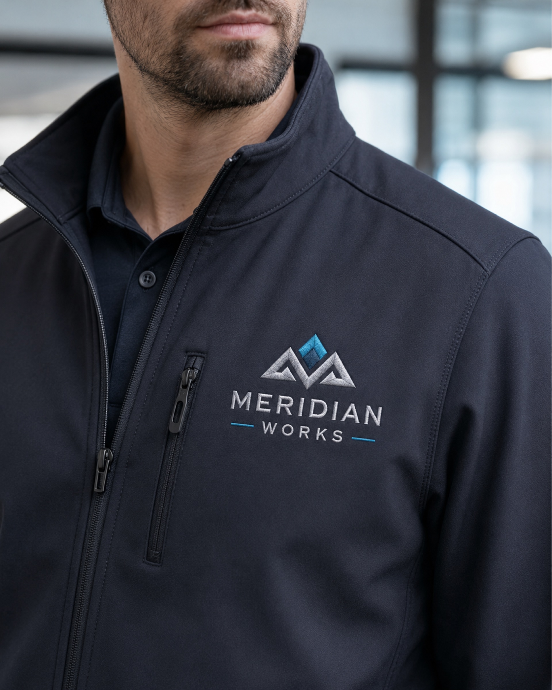 Embroidered logo on a corporate softshell jacket.